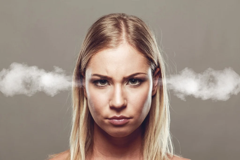 Frustrated woman looking at laptop as conversion rate drops